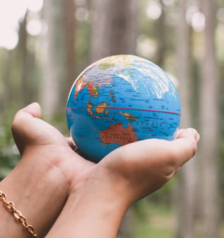 hand-holding-earth-globe-for-earth-day-concept-WWQQCP5-1